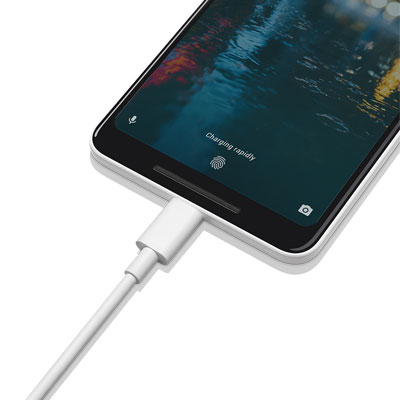   A USB cable plugged into the Google Pixel 2, with texts on the screen reading as “charging rapidly” 